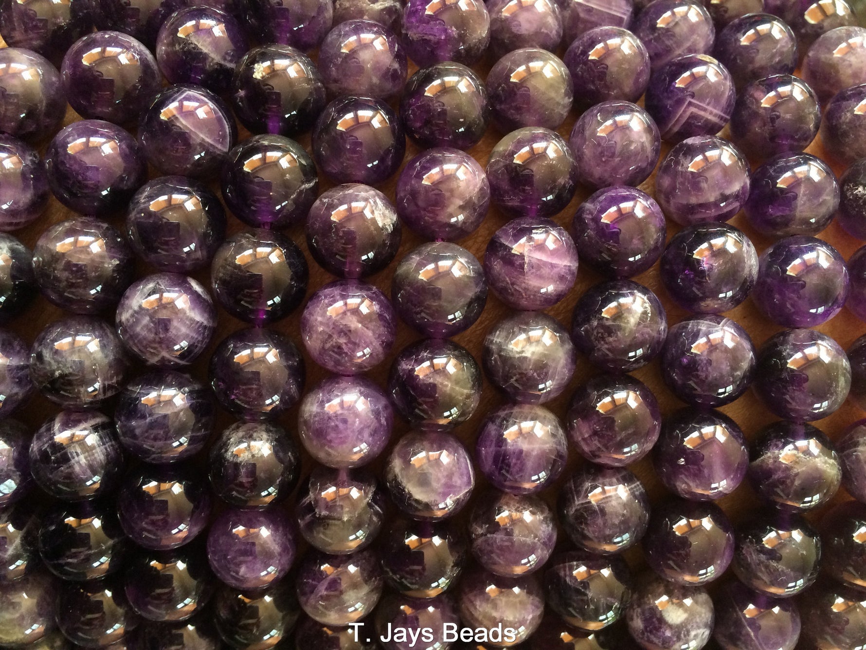 several strands of 10mm amethyst round beads