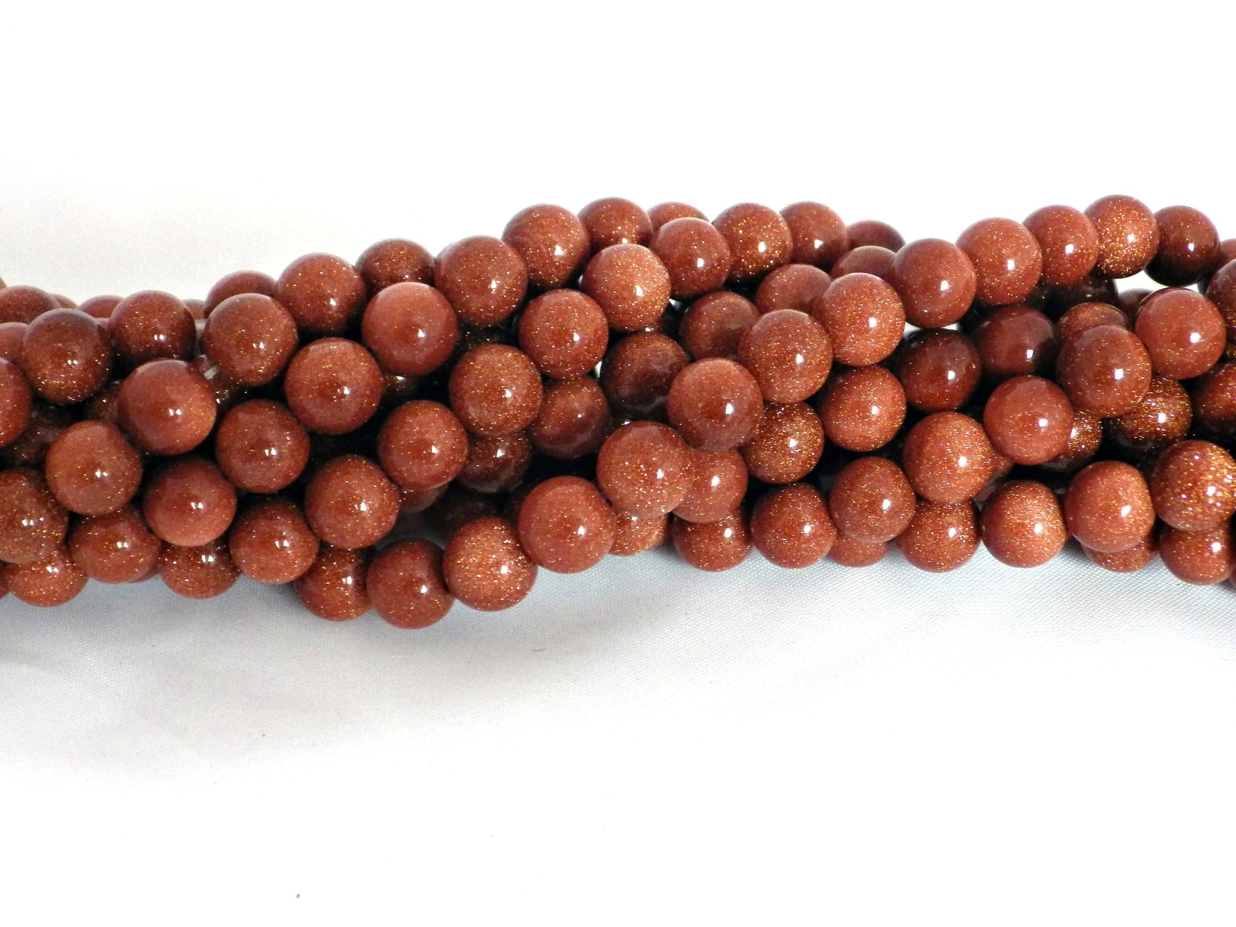Goldstone round beads - 6mm