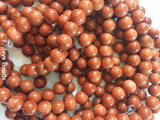Goldstone round beads - 6mm